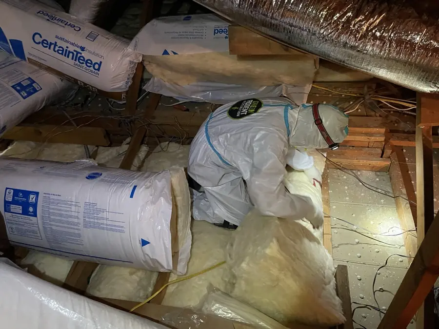 New insulation batts staged in an attic before installation
